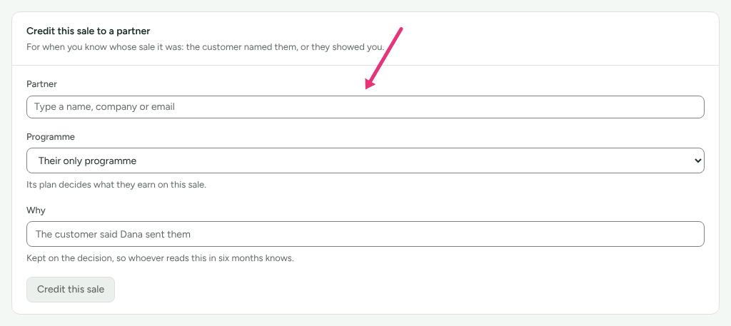 The Credit this sale to a partner card on a sale credited to nobody, with an arrow at the Partner search box.