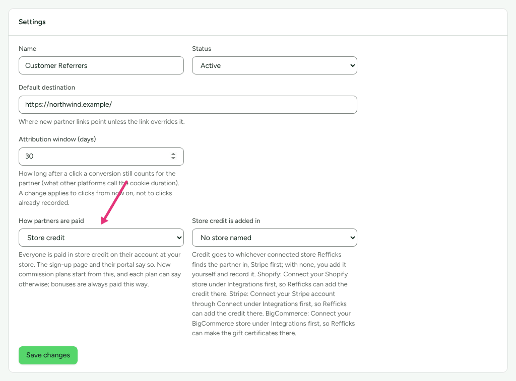 The Settings card of the Customer Referrers program, How partners are paid set to Store credit with its explanation above Save changes, and an arrow at How partners are paid.